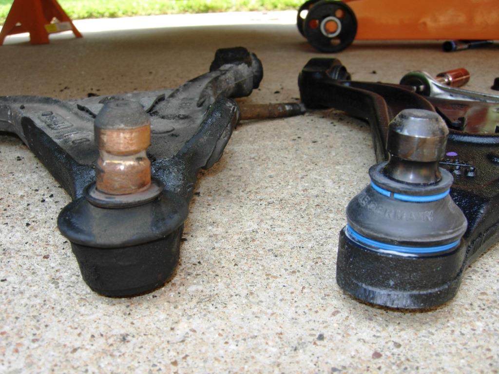What are some symptoms of worn ball joints?