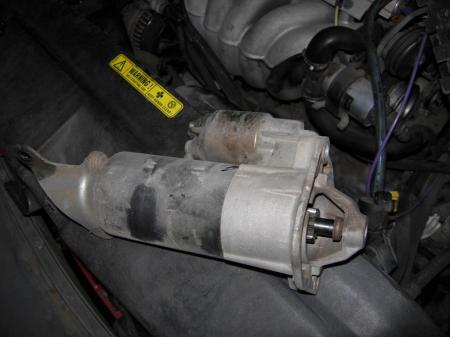 Starter should simply lift up and out once the three bolts are removed.